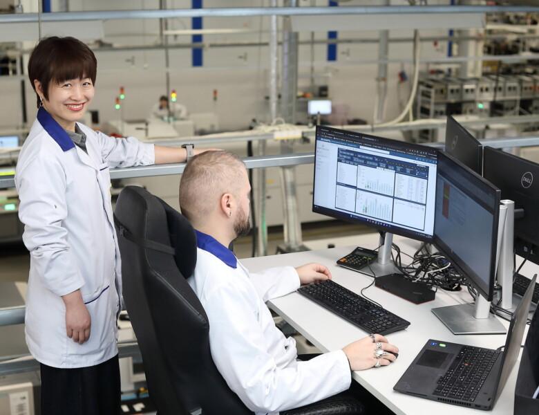Scanfil factory employees monitoring data in Scanfil factory.